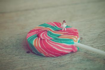 Miniature girl on colorful lollipop - image gratuit #187127 