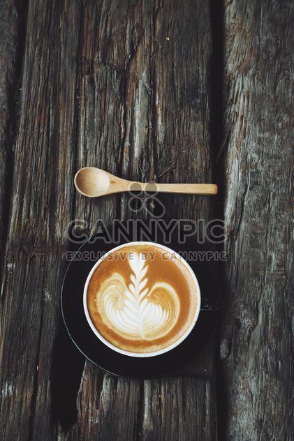 Coffee latte art on wooden background - image gratuit #187137 