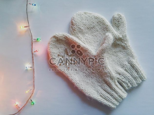 Mittens and garland on white background - image gratuit #198777 