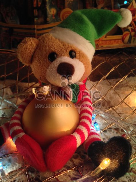 Cute soft teddy bear with a Christmas ball - бесплатный image #198807