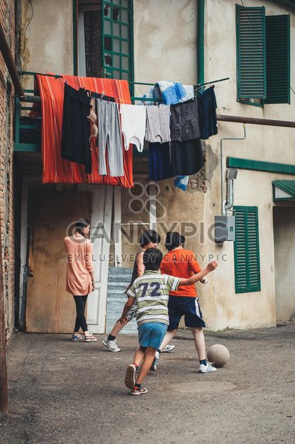 Children playing soccer - image #273877 gratis