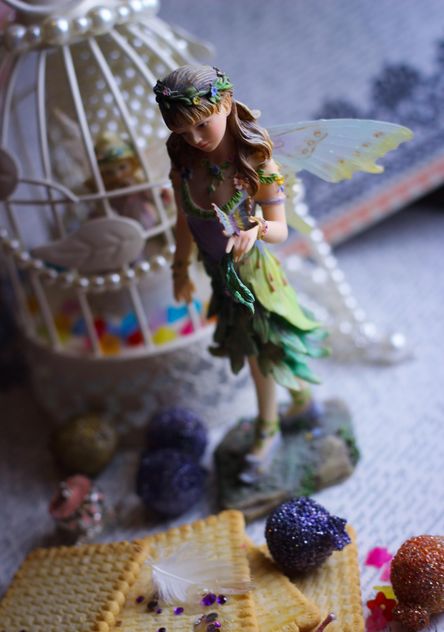Ceramic fairy doll with white bird cage - бесплатный image #341487