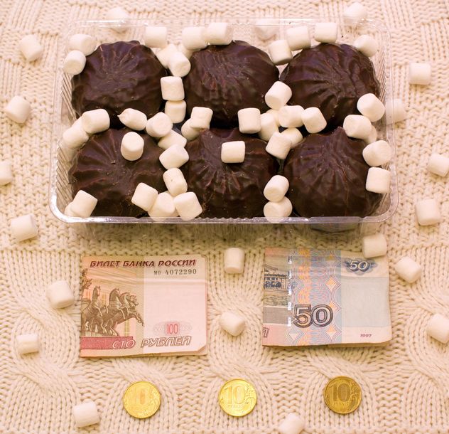 Zephyr in chocolate, marshmallows and money on knitted background - Free image #347917