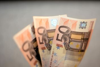 Closeup of Euro banknotes on grey background - бесплатный image #348417