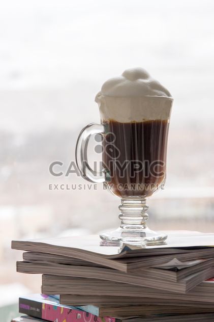 Cup of coffee on pile of magazines - Free image #350307