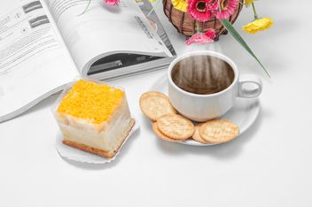 Cup of coffee with crackers, dessert and book - бесплатный image #452437