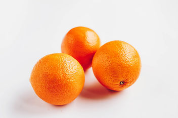 Group of three oranges on white background - Free image #453047