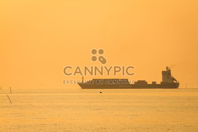 Ship in sea at sunset - Free image #136347