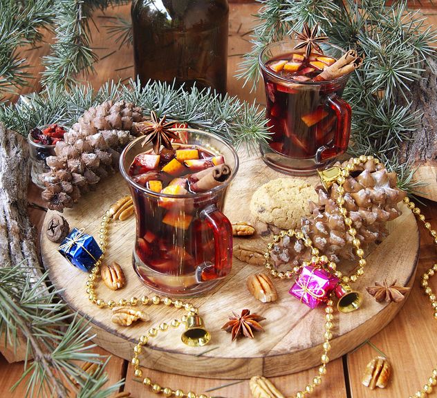 mulled wine in the cup and Christmas decorations - image #136647 gratis