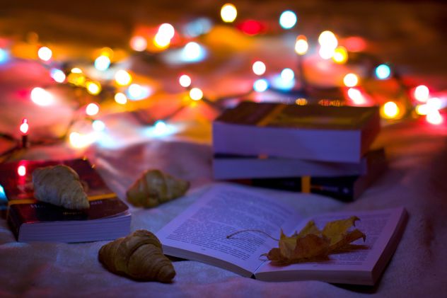 Books, croissants and garlands closeup - Free image #182567