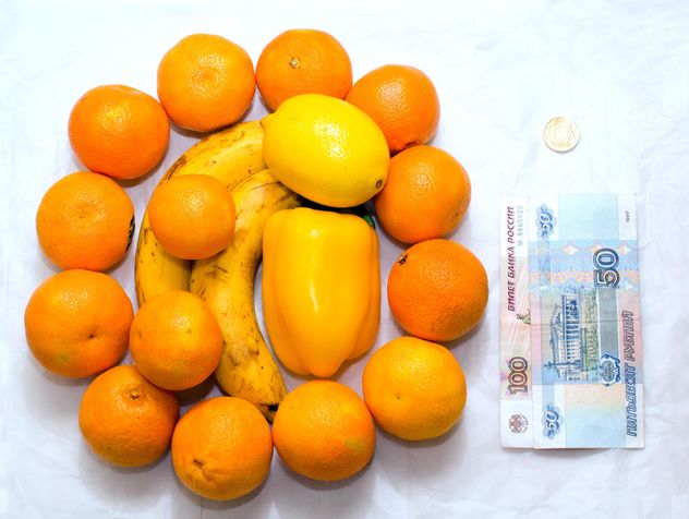 Fresh ripe fruit and money on white background - бесплатный image #182577