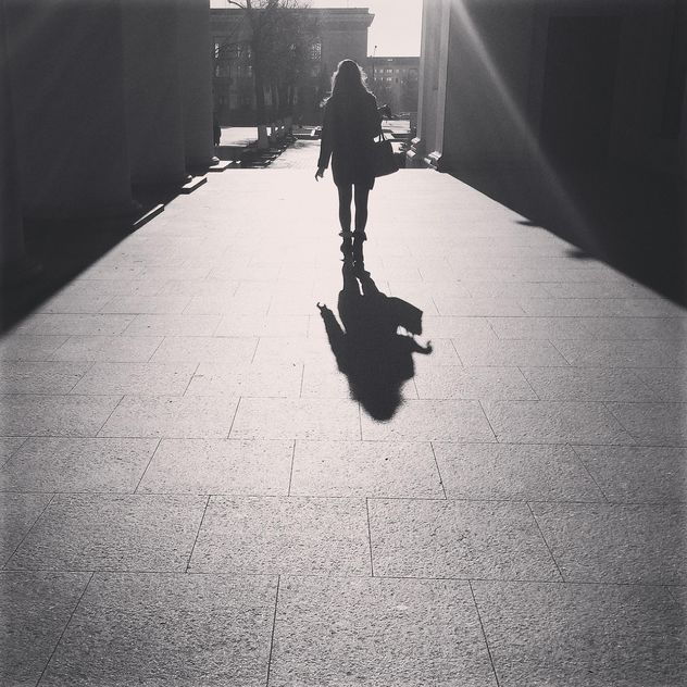 Girl walking in the street in sunny day, black and white - Free image #183667