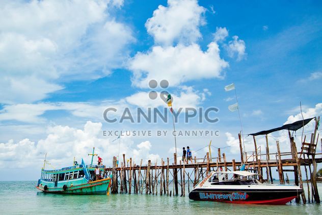 Boats moored near wooden pier - Free image #183847