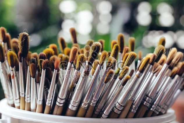 Close-up of paintbrushes in cup - image #186087 gratis