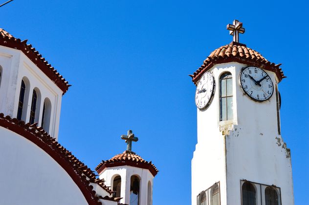Clock tower against blue sky - image #186247 gratis