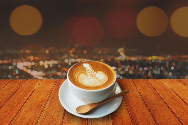 Coffee latte on wooden table - бесплатный image #186957
