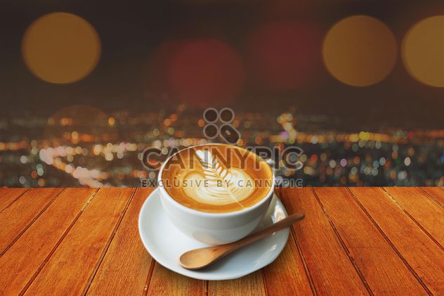 Coffee latte on wooden table - бесплатный image #186957