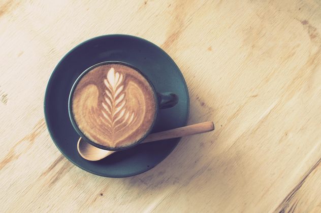 Coffee latte art on wooden table - image gratuit #187077 
