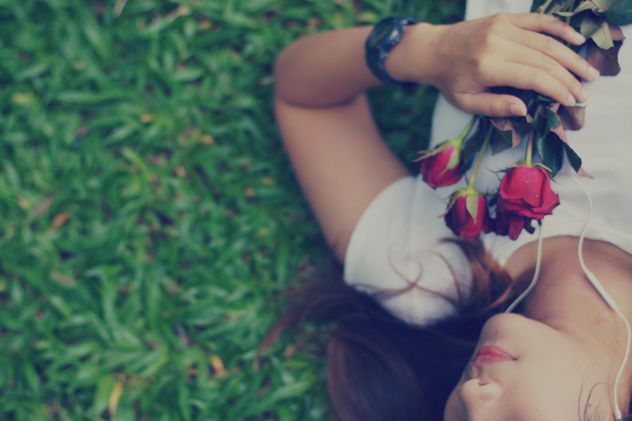 Girl with roses laying on grass - Free image #198087