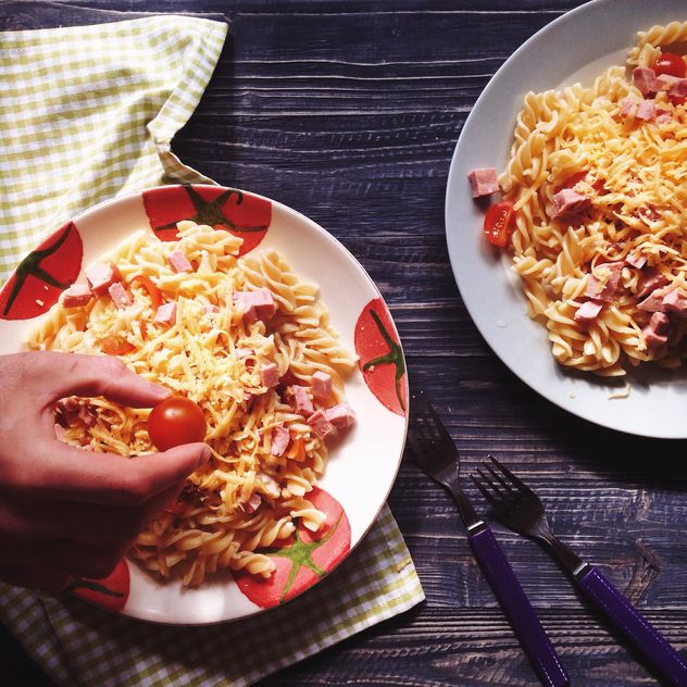 Two portions of pasta with cheese and tomato - Free image #198517