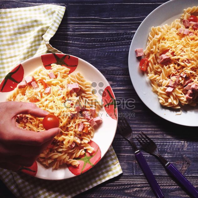 Two portions of pasta with cheese and tomato - image #198517 gratis