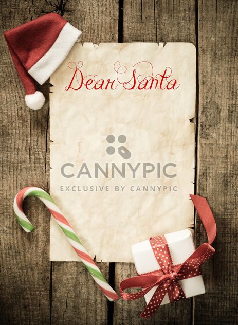 Letter to Santa and Christmas decorations over wooden background - бесплатный image #271597
