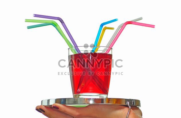 glass of juice with straws on a tray - image #273207 gratis