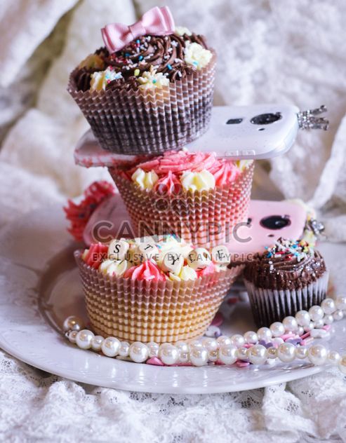 Smartphones with cupcakes - Free image #273777