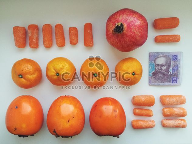 Orange set of vitamins and money on a white background - бесплатный image #304097