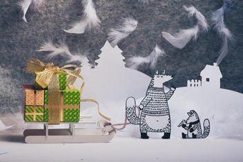 Paper cut foxes with gifts on sledge in winter - image gratuit #327307 