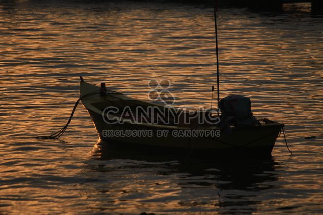 Boat on water at sunset - Free image #329997