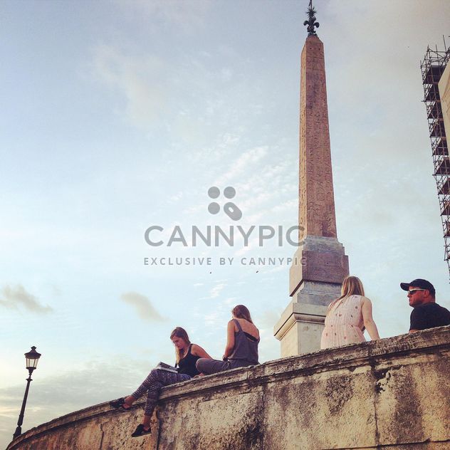 People sitting near Ancient Obelisk in Vatican - бесплатный image #331627