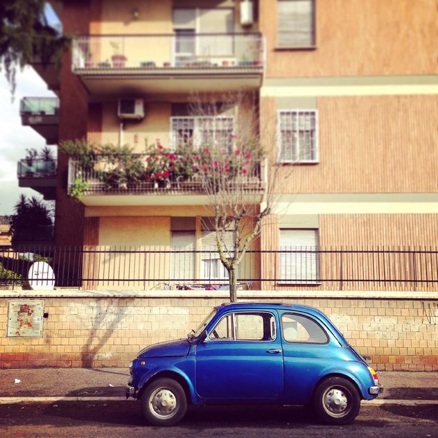 Blue Fiat 500 parked near the house in Rome, Italy - Free image #331817