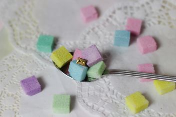 of Colorful Refined sugarcubes on a spoon - image #333567 gratis