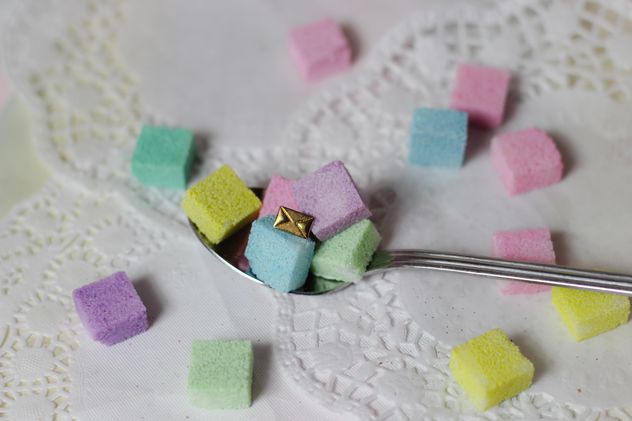 of Colorful Refined sugarcubes on a spoon - image gratuit #333567 