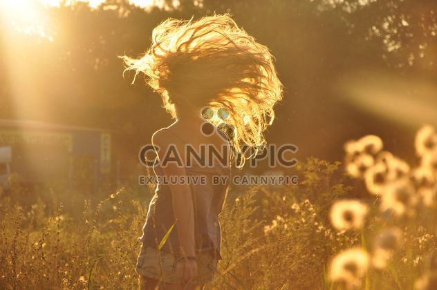 Girl in field at sunset - image gratuit #338567 
