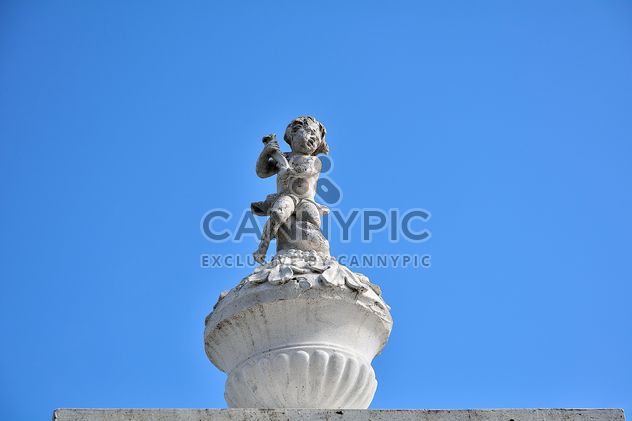 Statue on top of monastery against clear blue sky - бесплатный image #346277