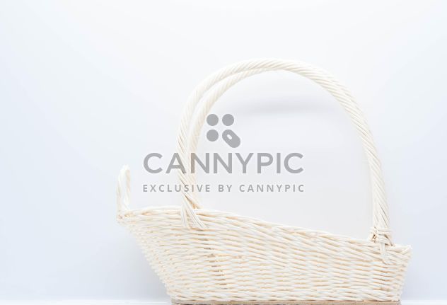 White wicker basket on white background - бесплатный image #347237