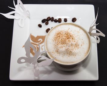 coffee in a white cup with a thick foam of milk and cinnamon - image #350287 gratis