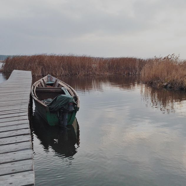 Landscape with boat on lake - image #363667 gratis