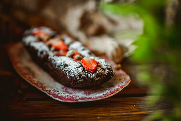 Chocolate Cake With Nuts And Strawberries On Vintage Plate - image #477887 gratis